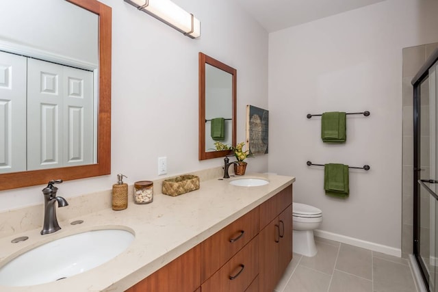 bathroom featuring an enclosed shower, tile patterned flooring, vanity, and toilet