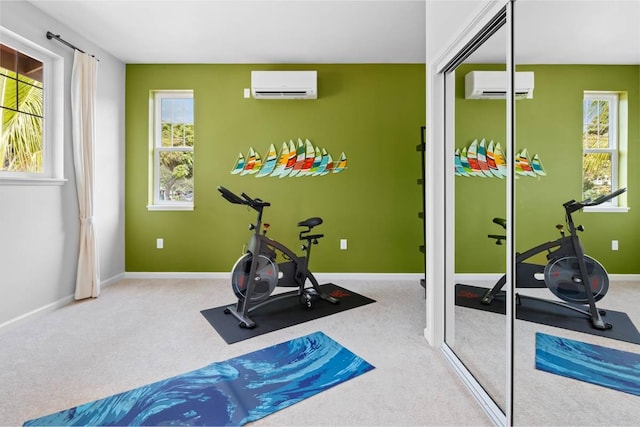 workout room featuring a wall unit AC and carpet floors