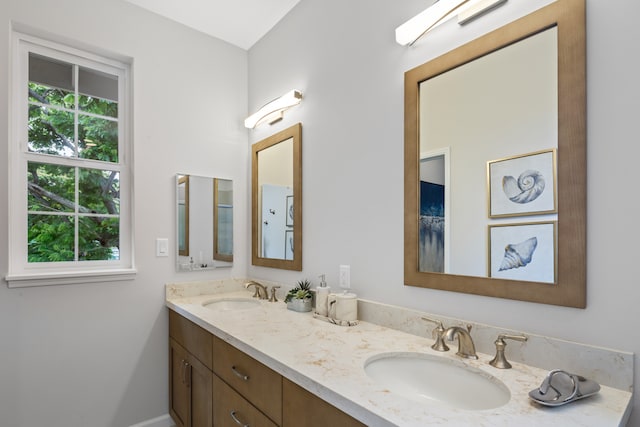 bathroom with a healthy amount of sunlight and vanity