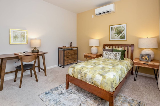 bedroom featuring an AC wall unit and light colored carpet