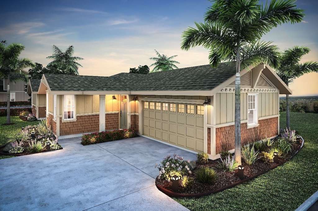 ranch-style home featuring a garage and a lawn