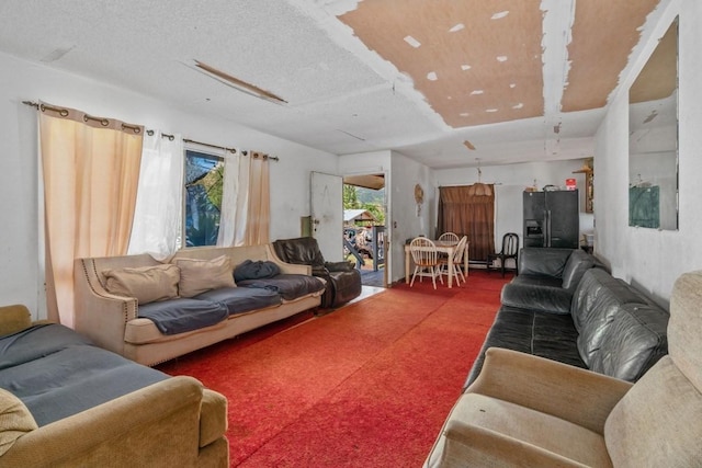 carpeted living room with a textured ceiling