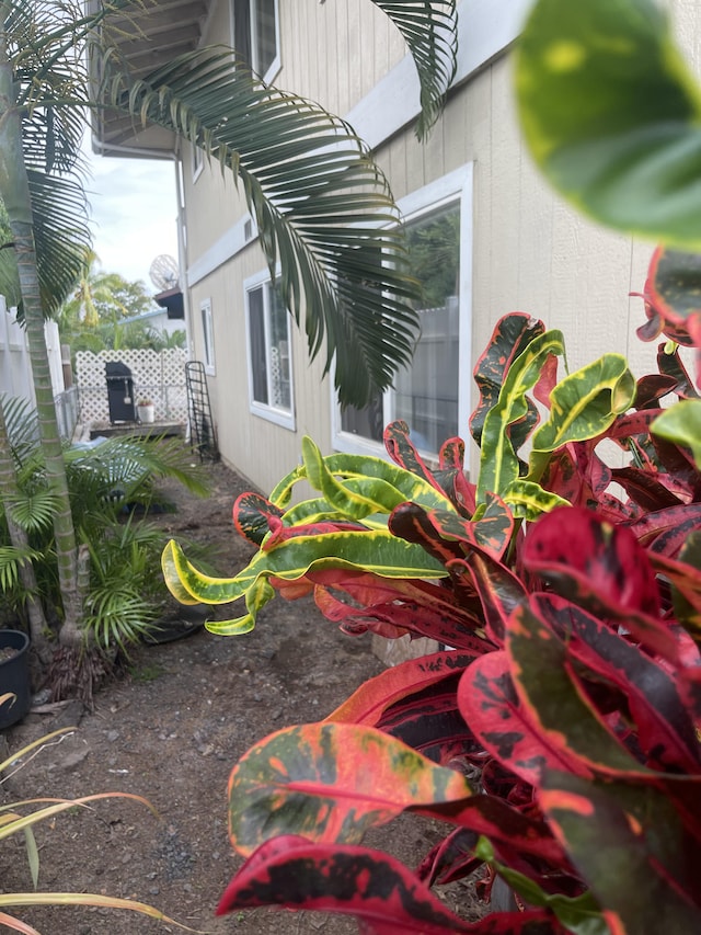 view of home's exterior with fence