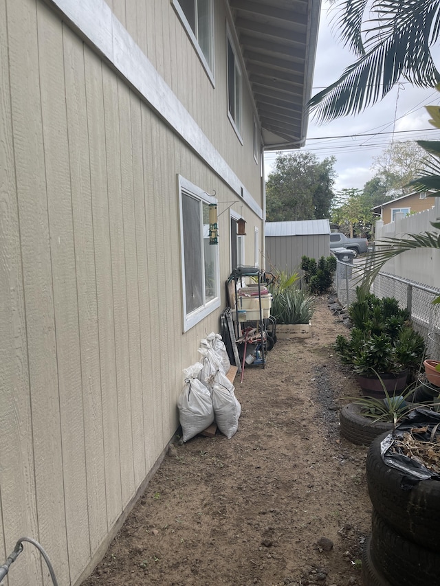 view of home's exterior with fence