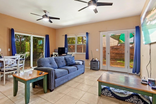 living room featuring ceiling fan and light tile floors