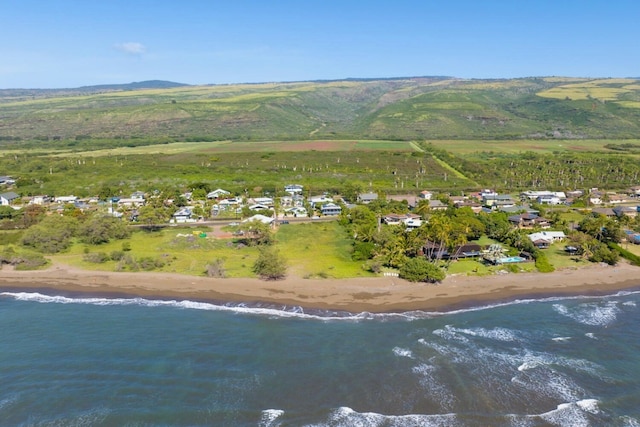 bird's eye view featuring a beach view and a water view