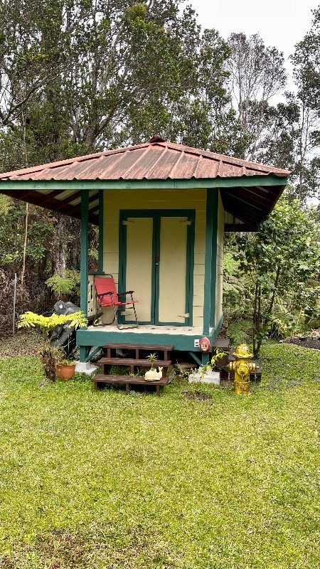 rear view of house with a yard