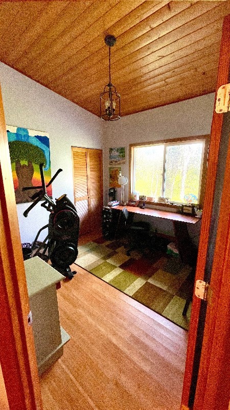 bedroom featuring wooden ceiling