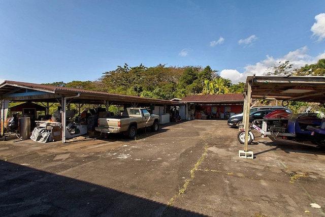 view of vehicle parking featuring a carport