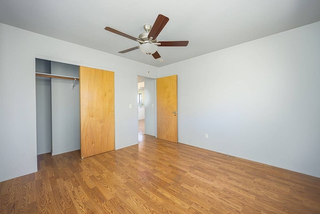 unfurnished bedroom featuring a closet, ceiling fan, and light hardwood / wood-style flooring