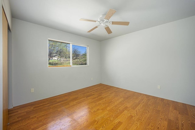 unfurnished room with light hardwood / wood-style floors and ceiling fan