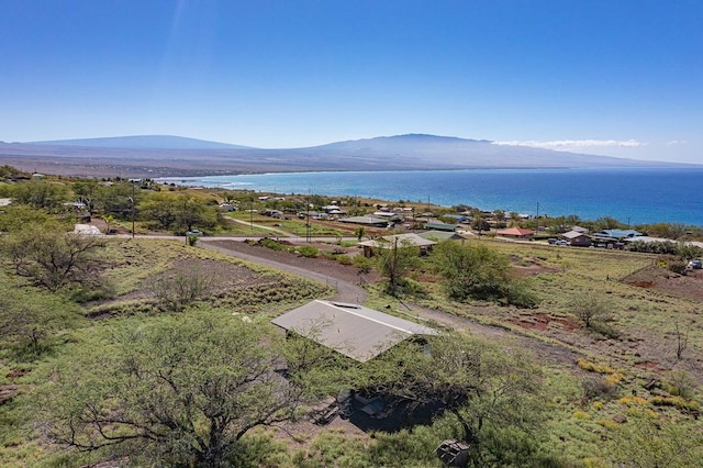 bird's eye view with a water and mountain view