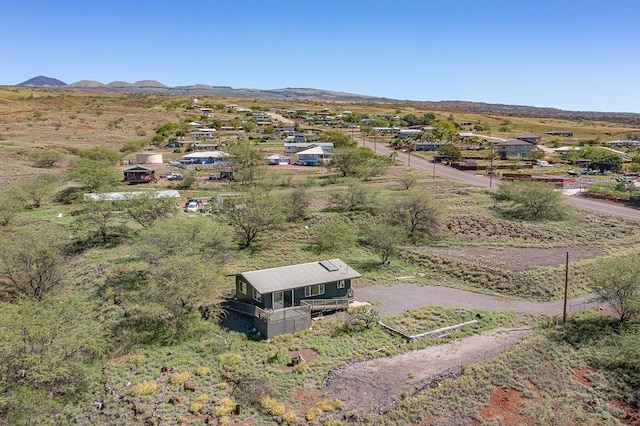 birds eye view of property featuring a mountain view