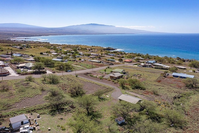 bird's eye view with a water and mountain view