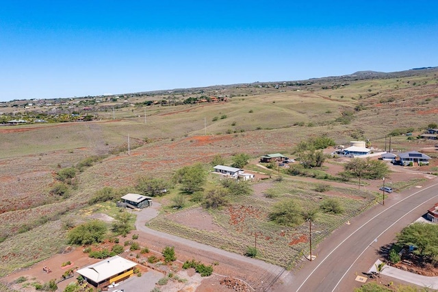 birds eye view of property with a rural view