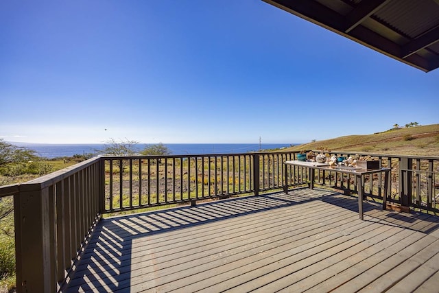 wooden terrace with a water view