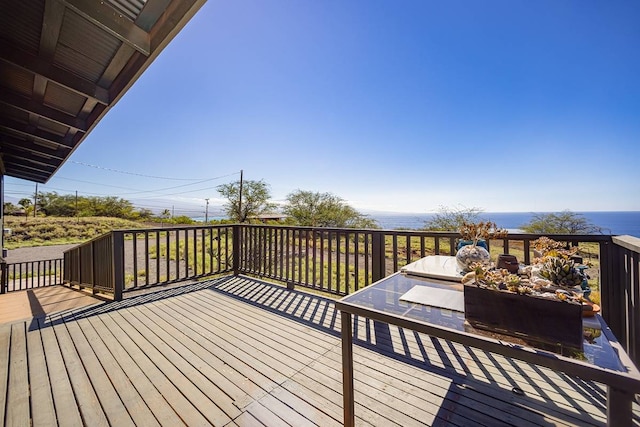 wooden deck featuring a water view