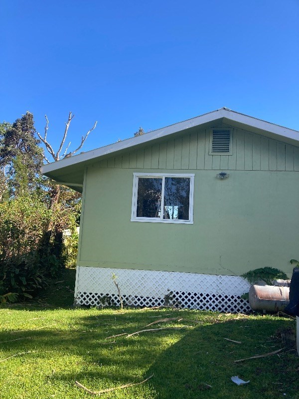 view of property exterior with a yard