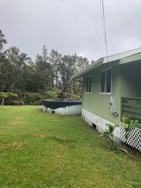 view of yard featuring a covered pool