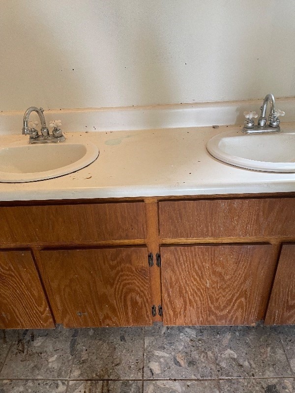 bathroom with tile flooring and vanity