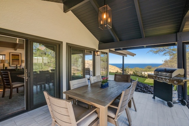 exterior space featuring a water view, wood ceiling, and vaulted ceiling with beams