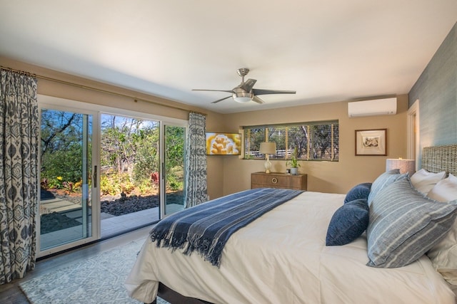 bedroom featuring a wall mounted air conditioner, access to exterior, ceiling fan, and light wood-type flooring