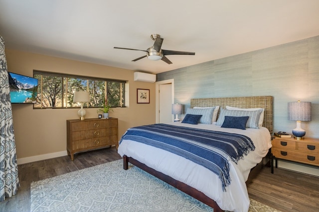 bedroom featuring ceiling fan, hardwood / wood-style flooring, and a wall unit AC