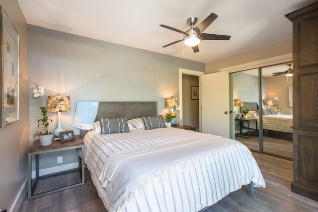 bedroom with a closet, ceiling fan, and dark hardwood / wood-style flooring