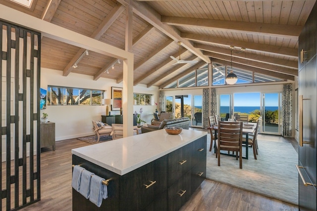 kitchen featuring a center island, wood ceiling, and beam ceiling