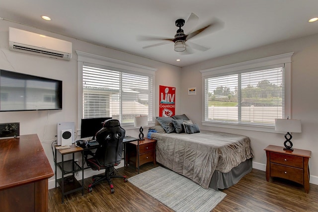 bedroom featuring a wall mounted air conditioner, dark hardwood / wood-style flooring, and ceiling fan