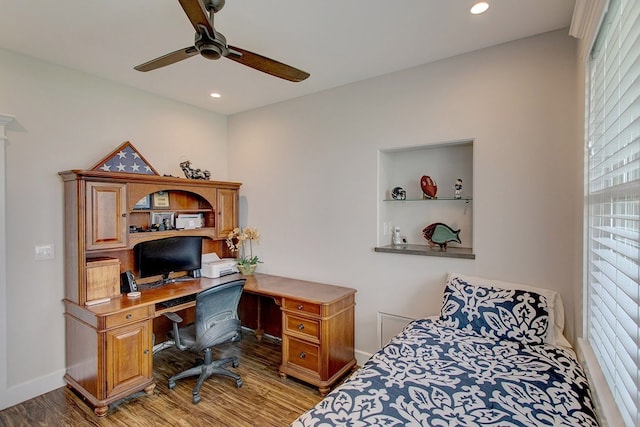 bedroom with wood-type flooring and ceiling fan