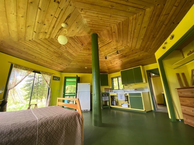 bedroom with multiple windows, white refrigerator, wood ceiling, and vaulted ceiling