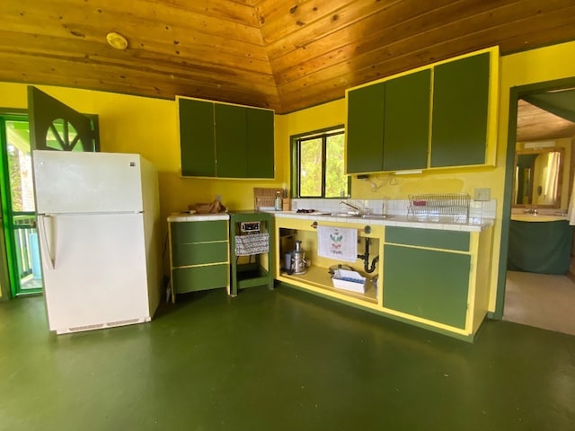 kitchen featuring lofted ceiling, wooden ceiling, green cabinetry, and white refrigerator