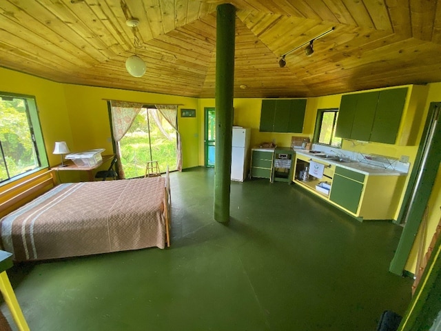 unfurnished bedroom featuring track lighting, sink, vaulted ceiling, wood ceiling, and white refrigerator