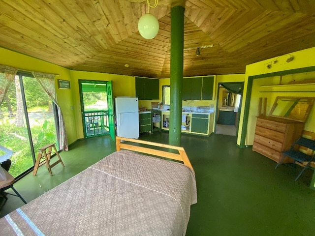 bedroom with wood ceiling, white fridge, and lofted ceiling