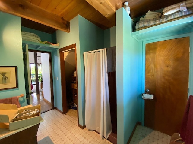 bathroom featuring tile flooring and wooden ceiling