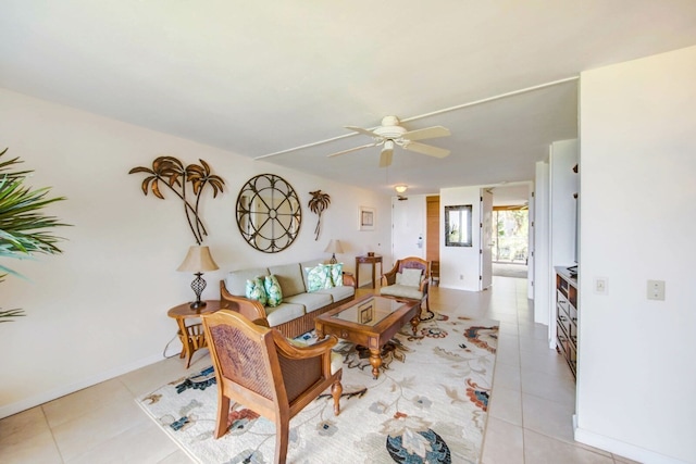 tiled living room with ceiling fan