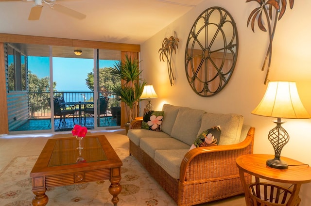 tiled living room with ceiling fan