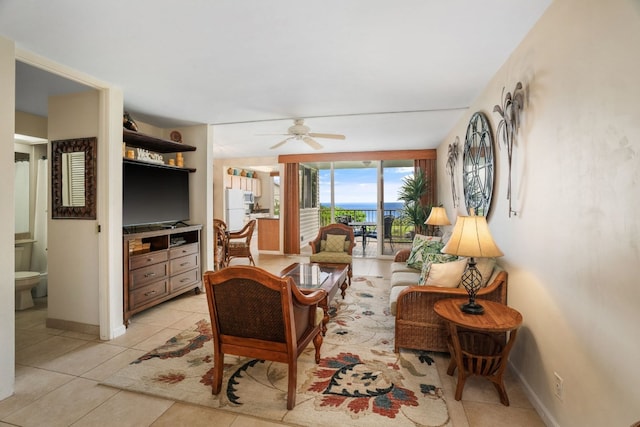 tiled living room featuring ceiling fan