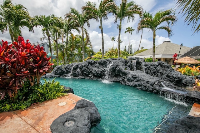 view of swimming pool featuring pool water feature