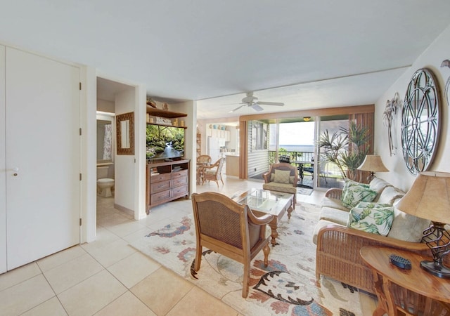 tiled living room featuring ceiling fan