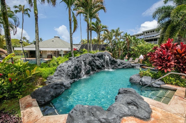 view of pool with pool water feature