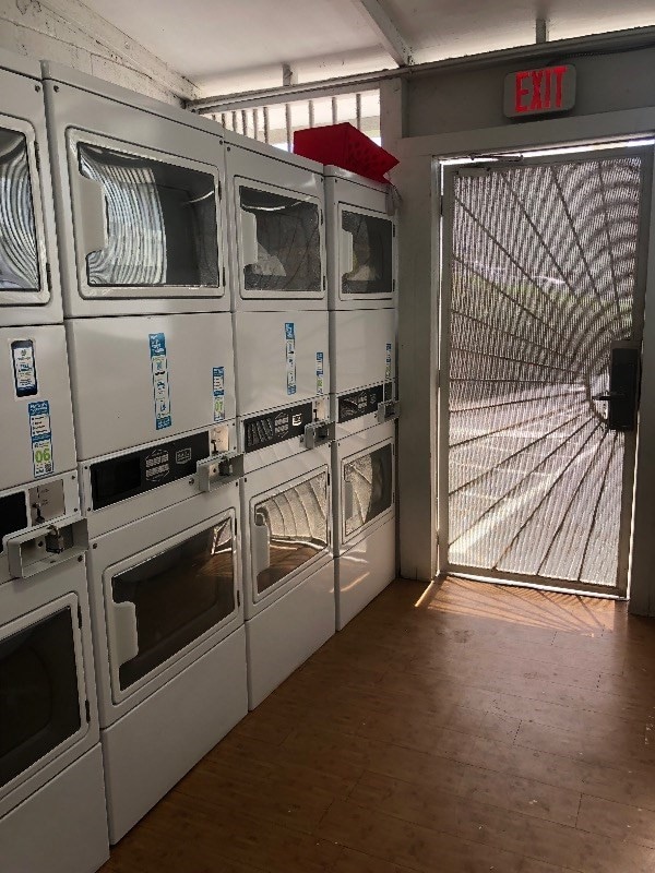 interior space with stacked washer and clothes dryer