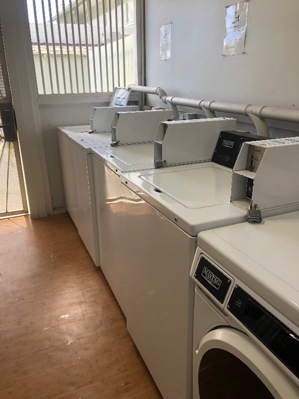 laundry room featuring light hardwood / wood-style flooring and separate washer and dryer