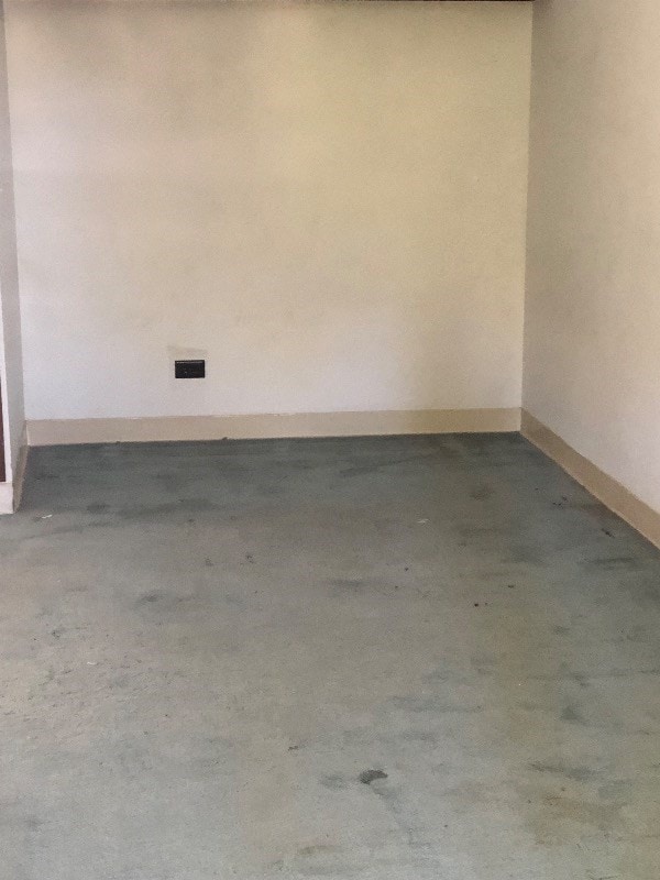 spare room with concrete flooring