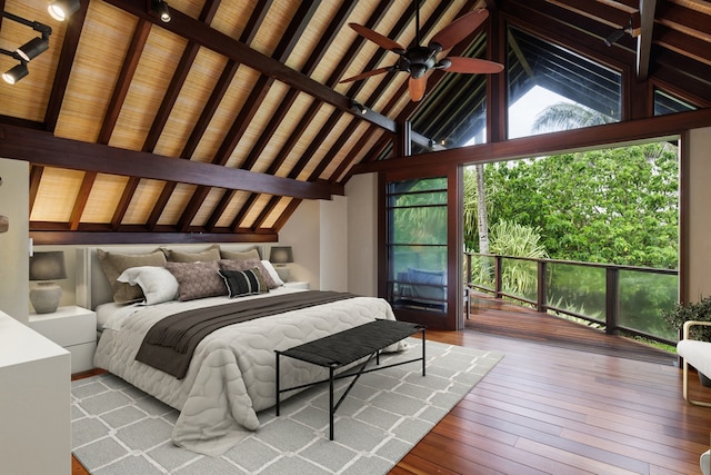 bedroom featuring hardwood / wood-style flooring, high vaulted ceiling, beam ceiling, and wooden ceiling