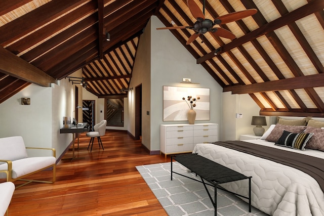 bedroom featuring hardwood / wood-style flooring, lofted ceiling with beams, and wooden ceiling