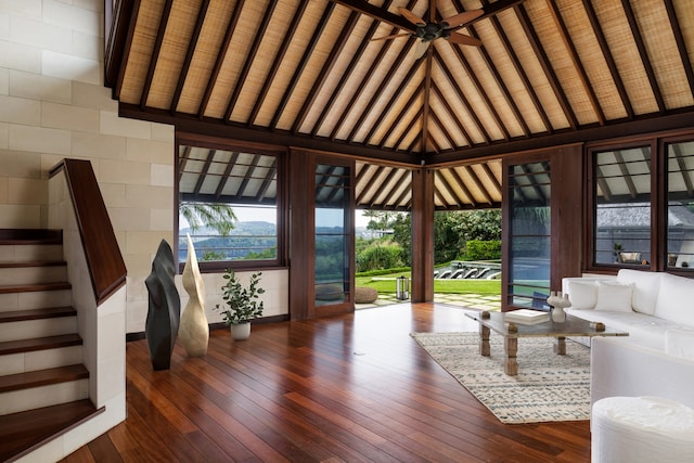 interior space featuring wooden ceiling, beamed ceiling, ceiling fan, high vaulted ceiling, and dark hardwood / wood-style flooring