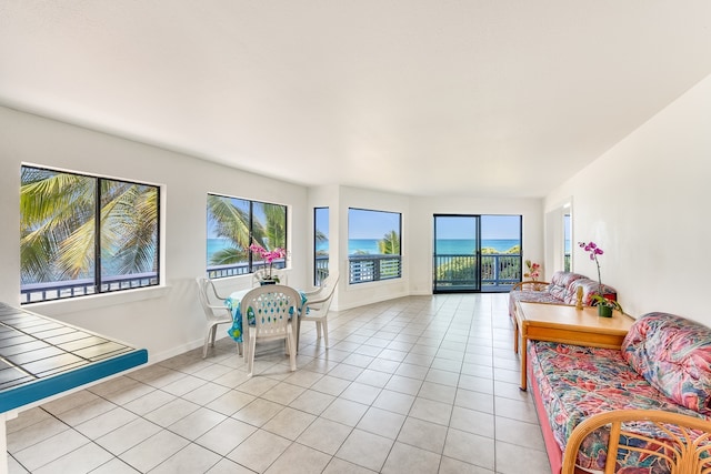 tiled living room with a water view