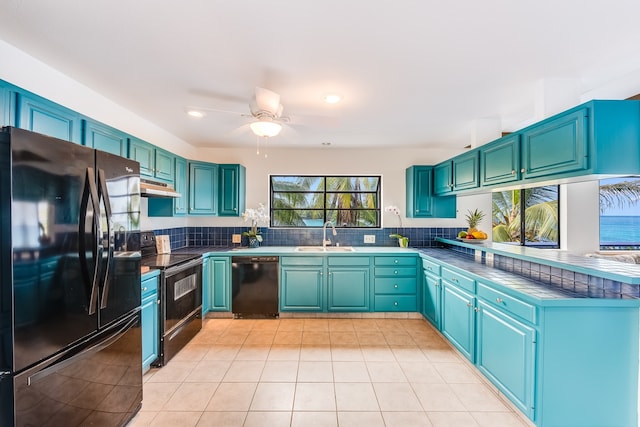 kitchen featuring light tile flooring, tasteful backsplash, ceiling fan, sink, and black appliances